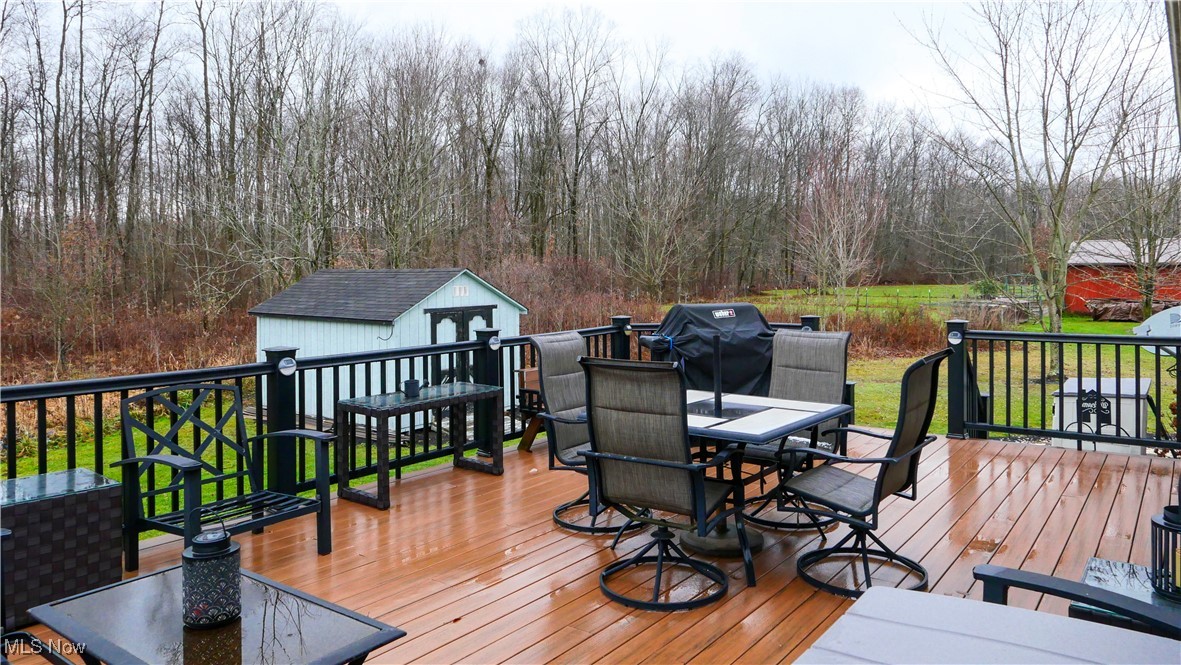 17296 Old State Road Middlefield, OH 44062 - Photo 30 of 44 Deck featuring a storage unit