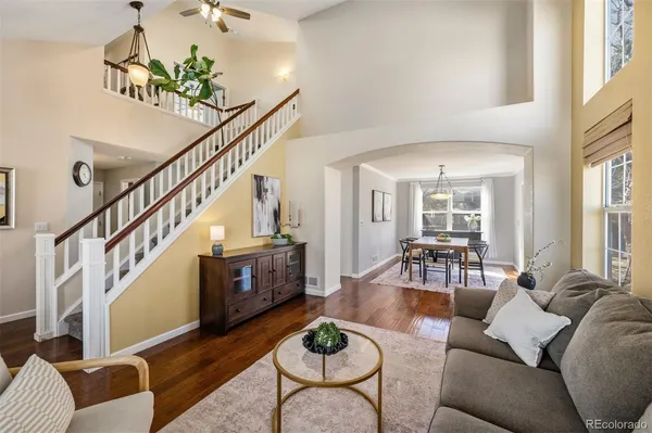 a living room with furniture and a table