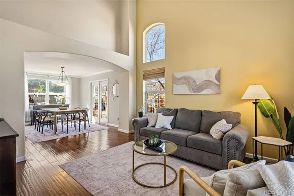 a living room with furniture and a table