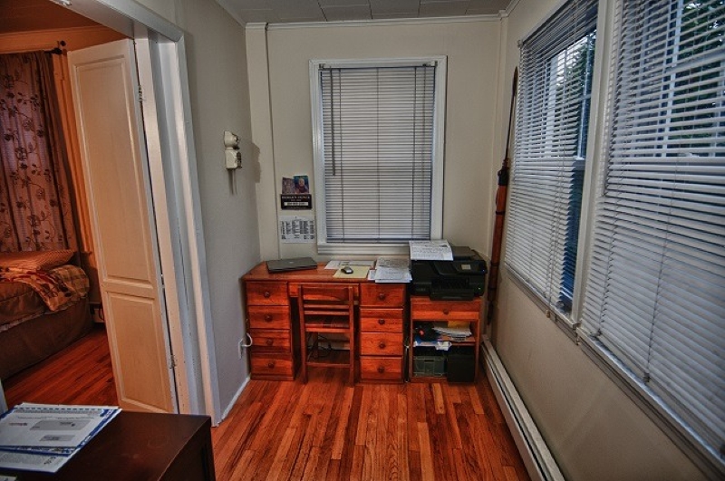 40 Beach Street, Unit 1R Bloomfield, NJ 07003 - Photo 14 of 18 a room with wooden floor and furniture