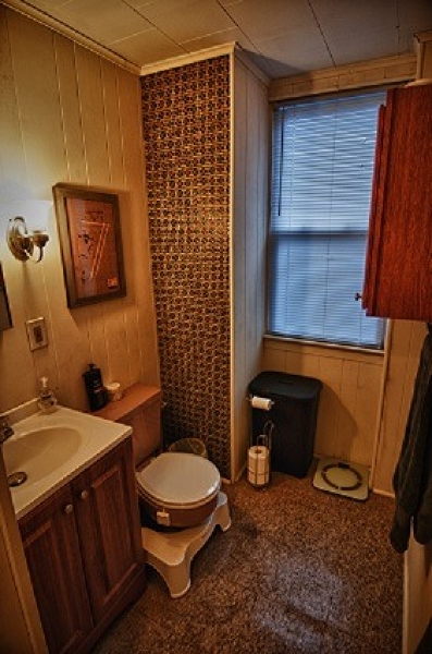 40 Beach Street, Unit 1R Bloomfield, NJ 07003 - Photo 9 of 18 a bathroom with a toilet a sink and mirror