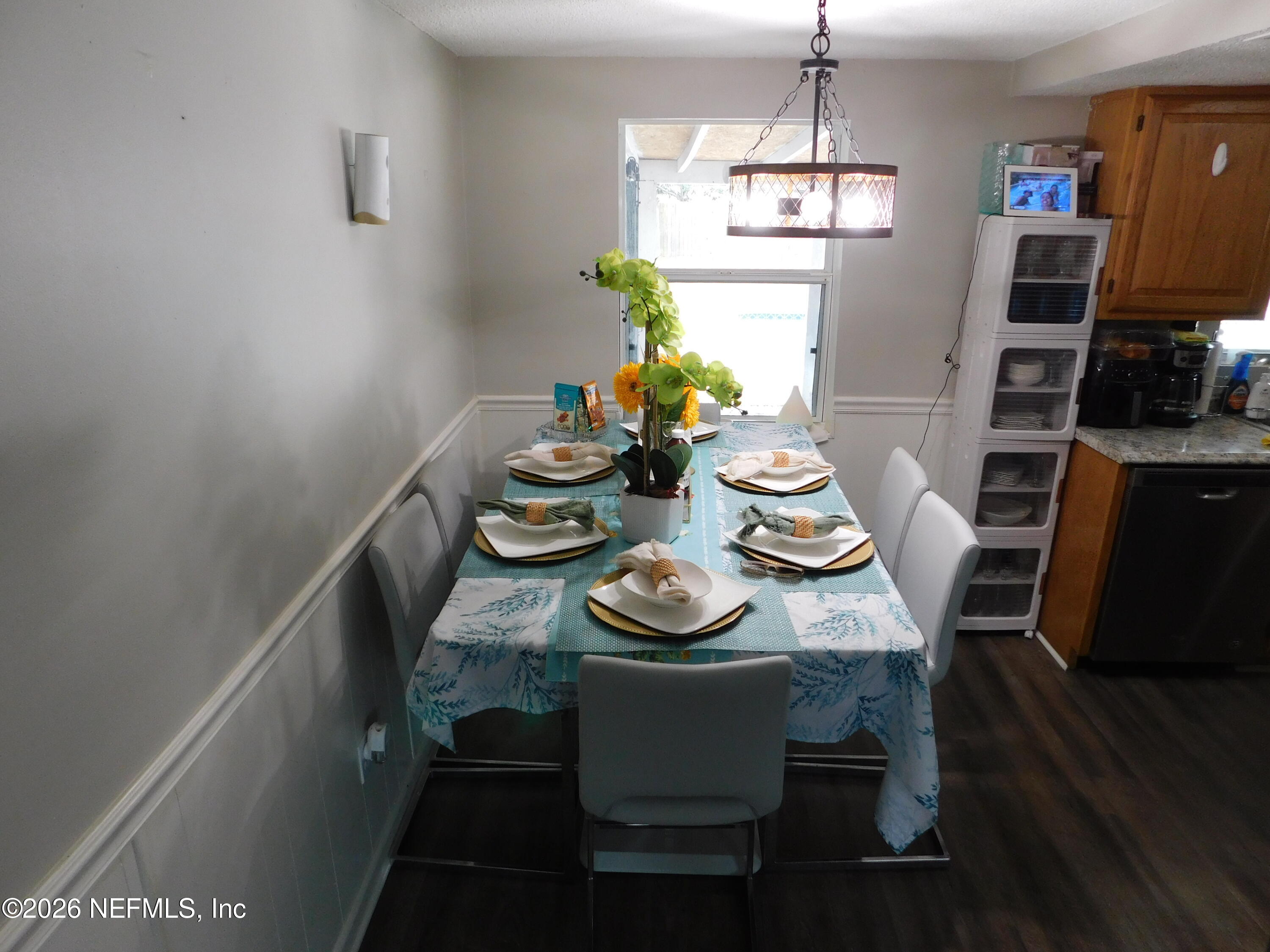 2798 Commanche Avenue Orange Park, FL 32065 - Photo 14 of 42 a dining room with furniture a chandelier and wooden floor