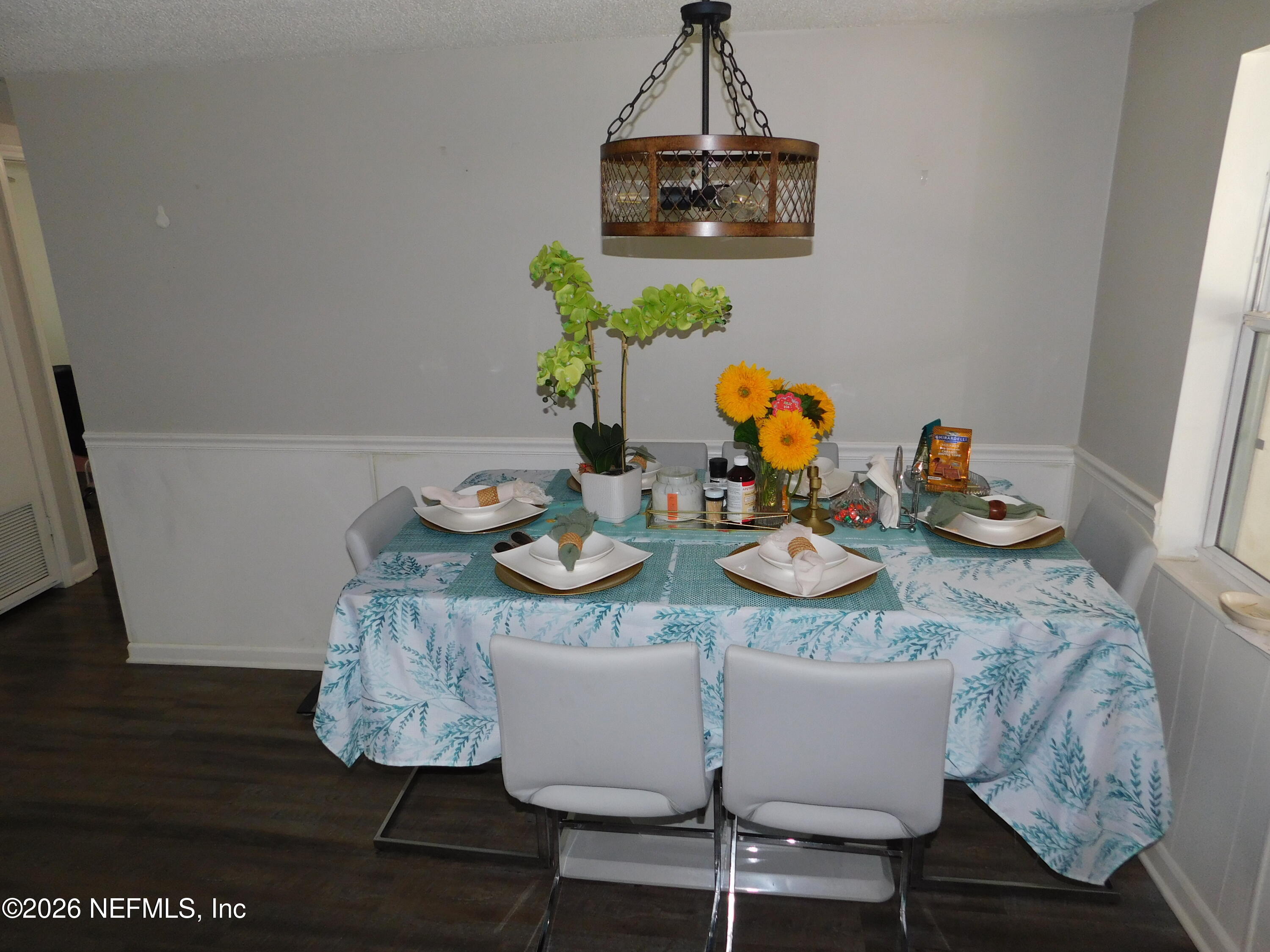 2798 Commanche Avenue Orange Park, FL 32065 - Photo 16 of 42 a dining room with furniture a chandelier and wooden floor