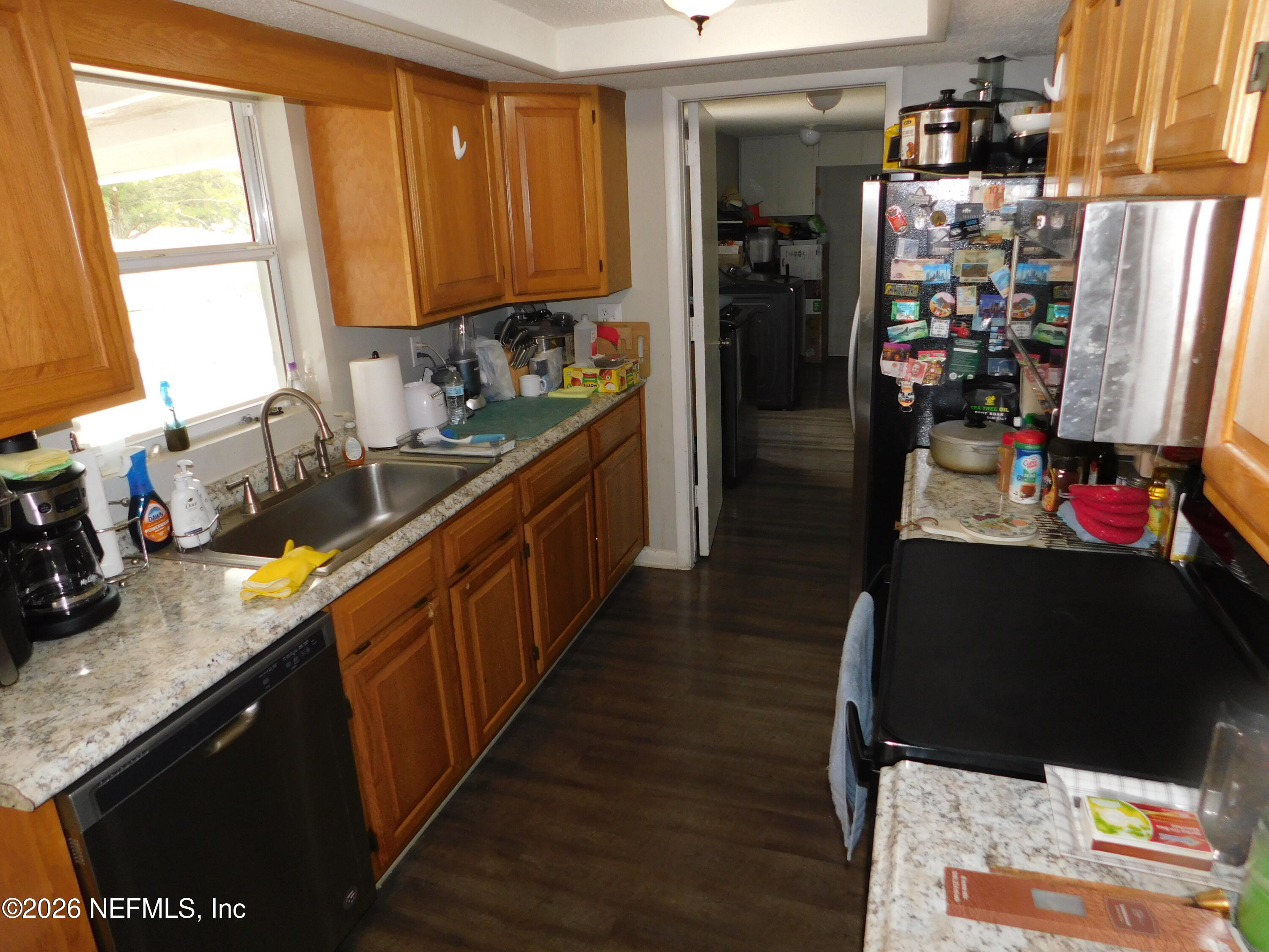 2798 Commanche Avenue Orange Park, FL 32065 - Photo 17 of 42 a kitchen with lots of counter top space and wooden floor