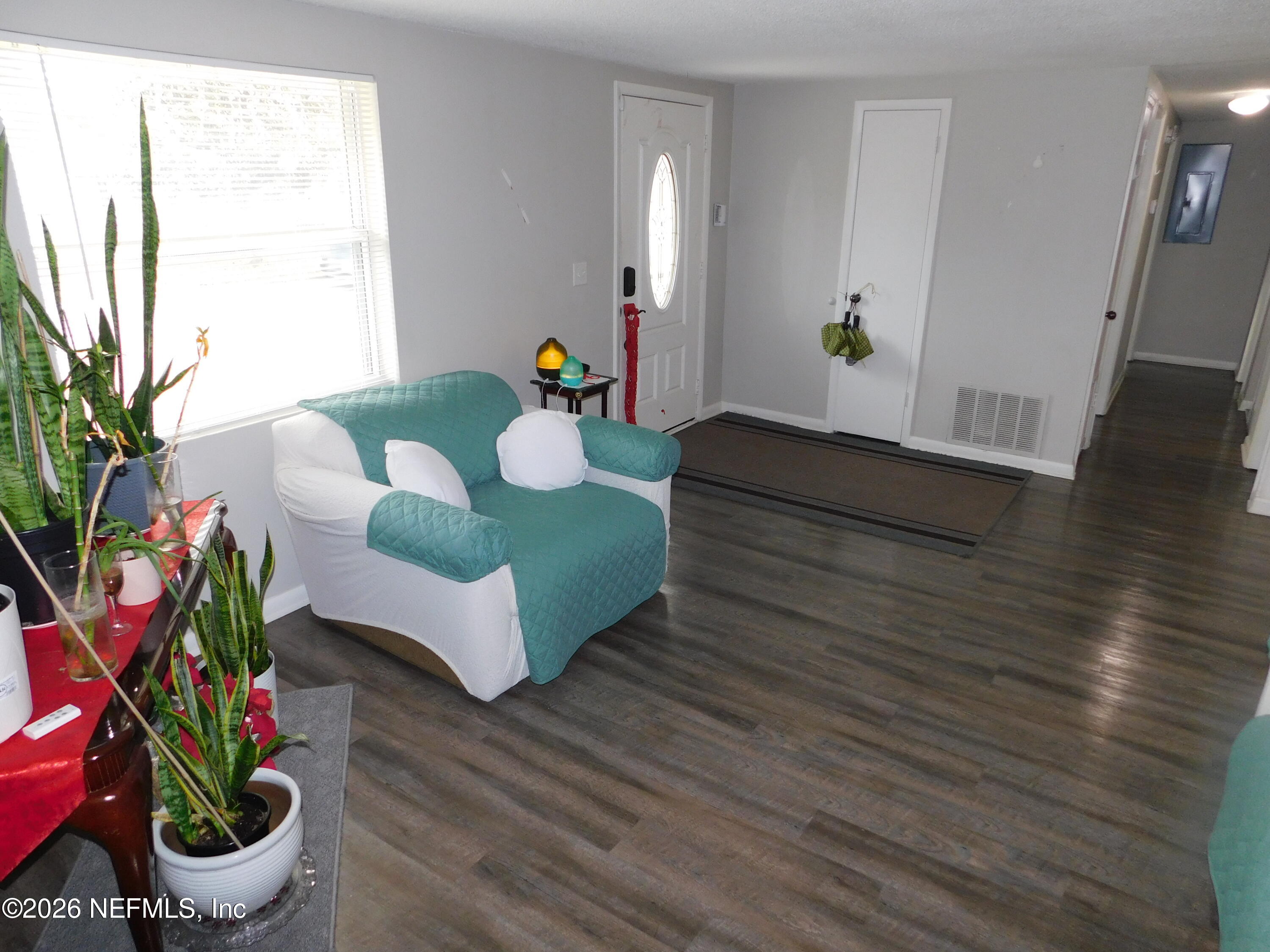 2798 Commanche Avenue Orange Park, FL 32065 - Photo 22 of 42 a living room with furniture and flowers