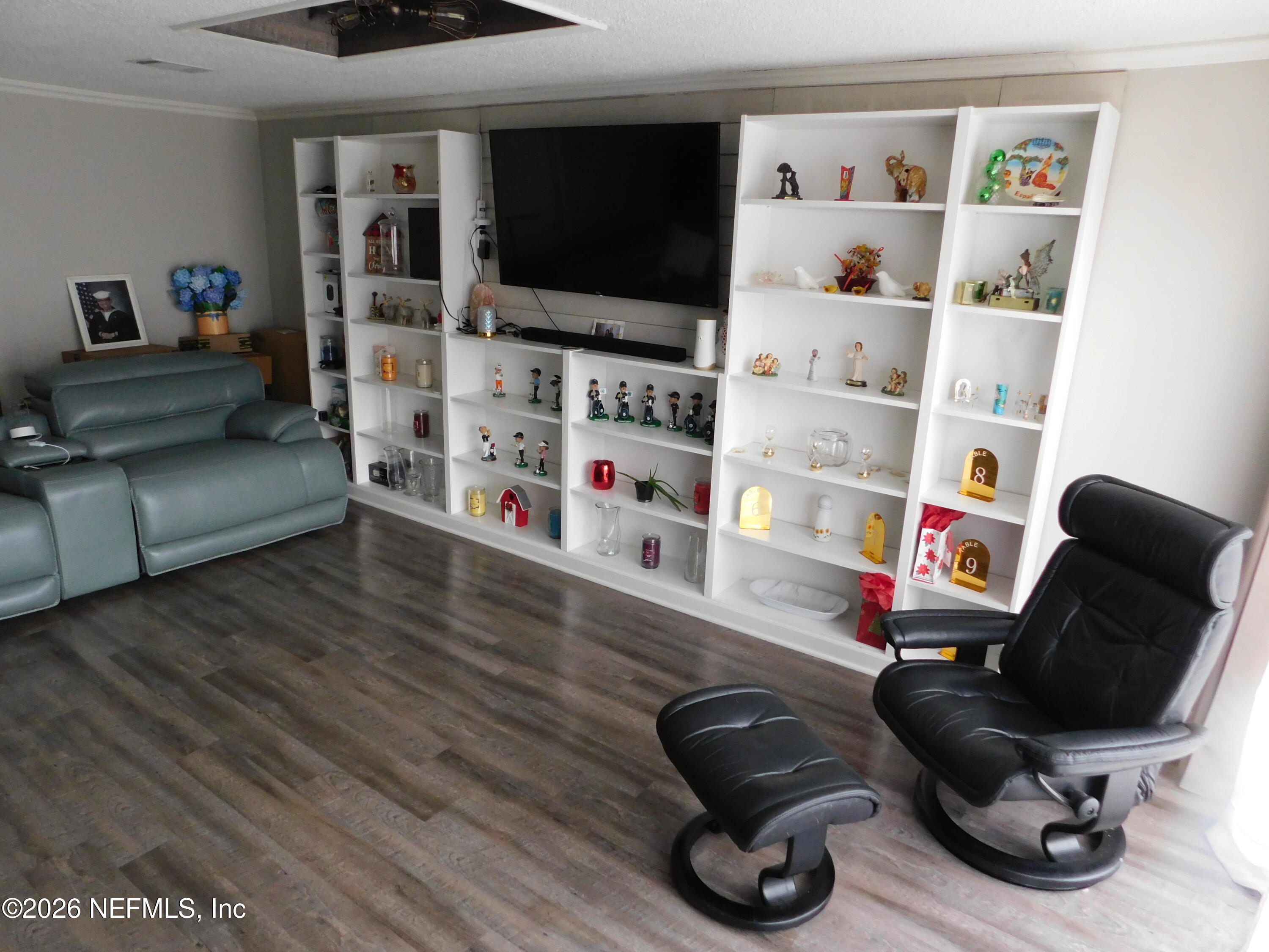 2798 Commanche Avenue Orange Park, FL 32065 - Photo 24 of 42 a room with furniture and a flat screen tv