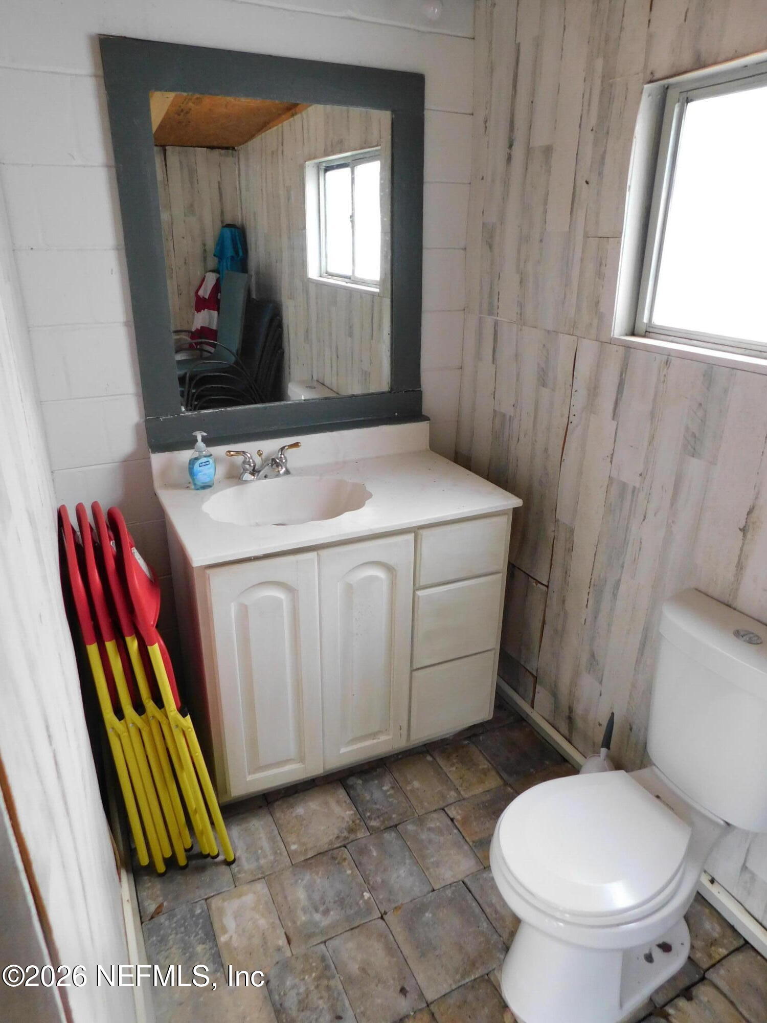 2798 Commanche Avenue Orange Park, FL 32065 - Photo 29 of 42 a bathroom with a toilet sink and mirror