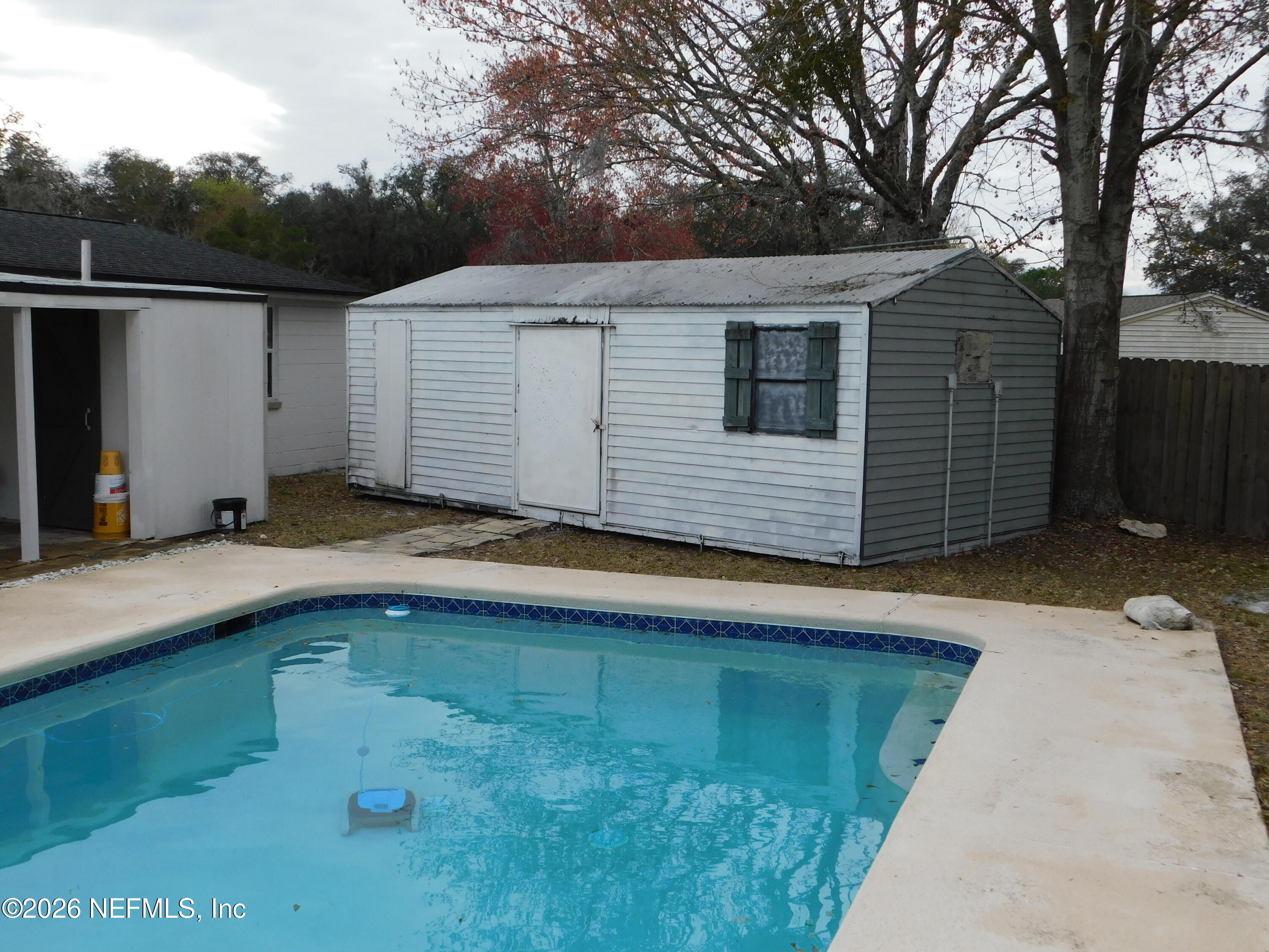 2798 Commanche Avenue Orange Park, FL 32065 - Photo 30 of 42 a view of a house with a backyard and a patio