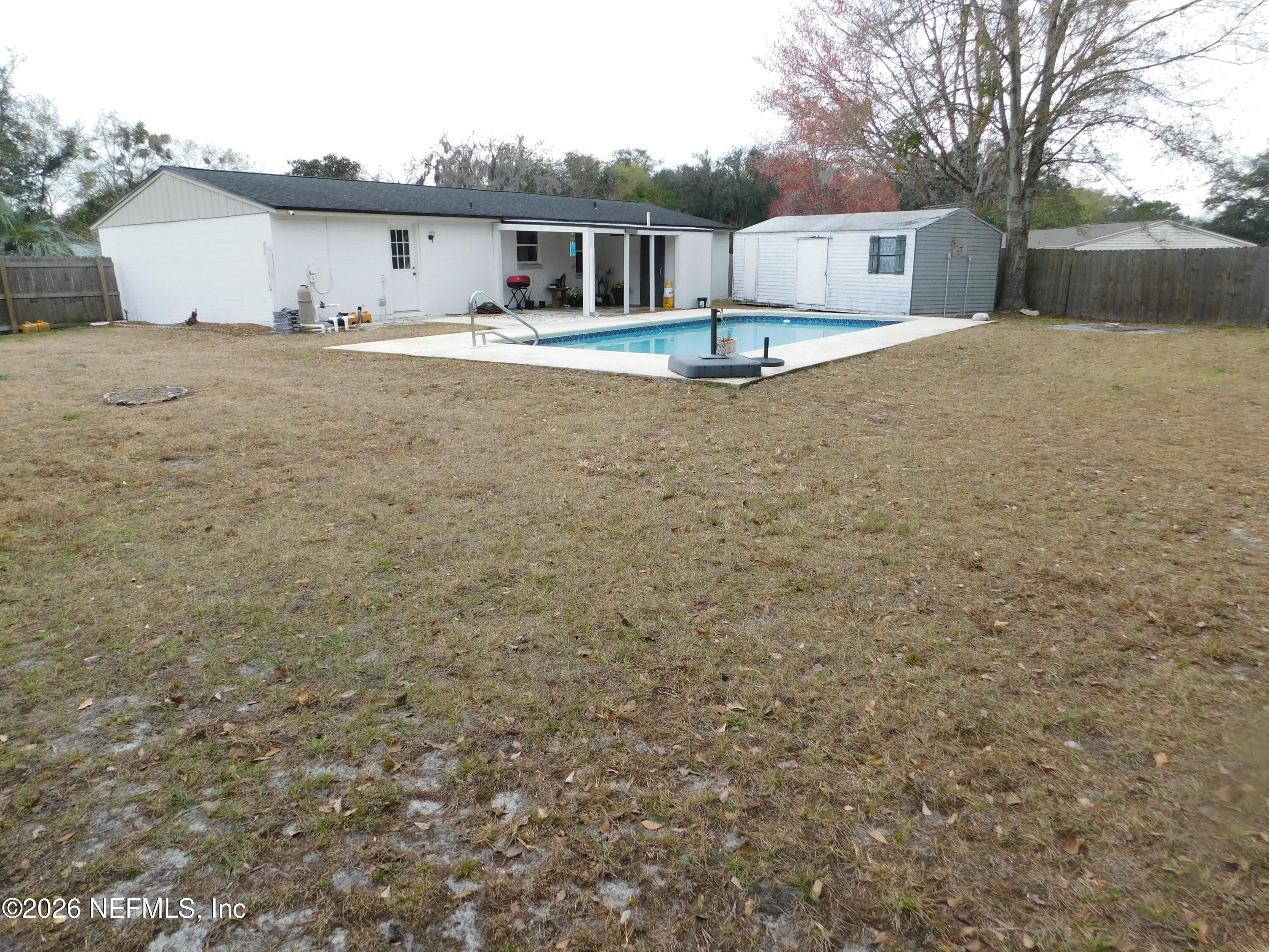 2798 Commanche Avenue Orange Park, FL 32065 - Photo 36 of 42 a view of a house with a yard and garage