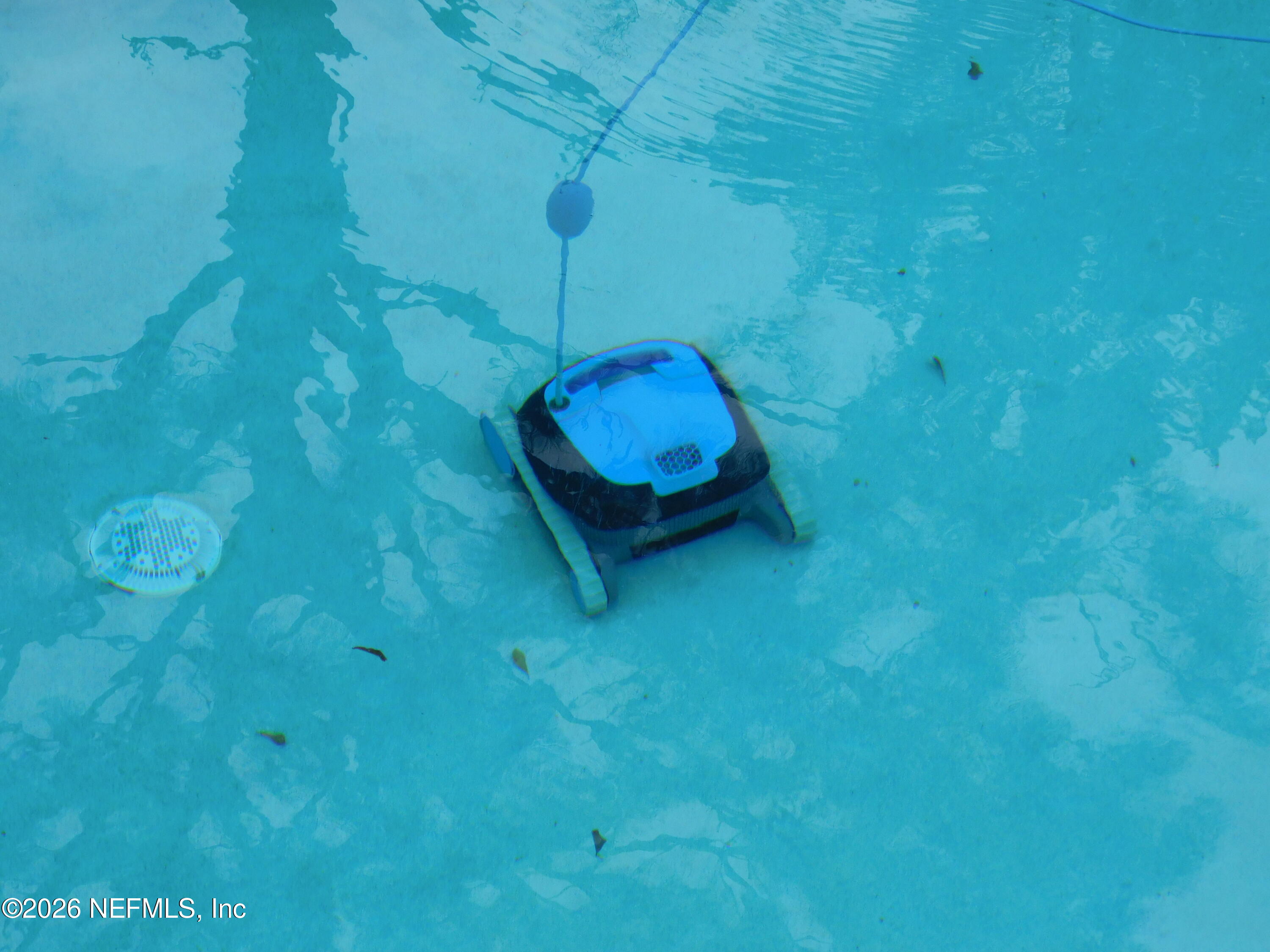 2798 Commanche Avenue Orange Park, FL 32065 - Photo 41 of 42 a room with a table and a chandelier