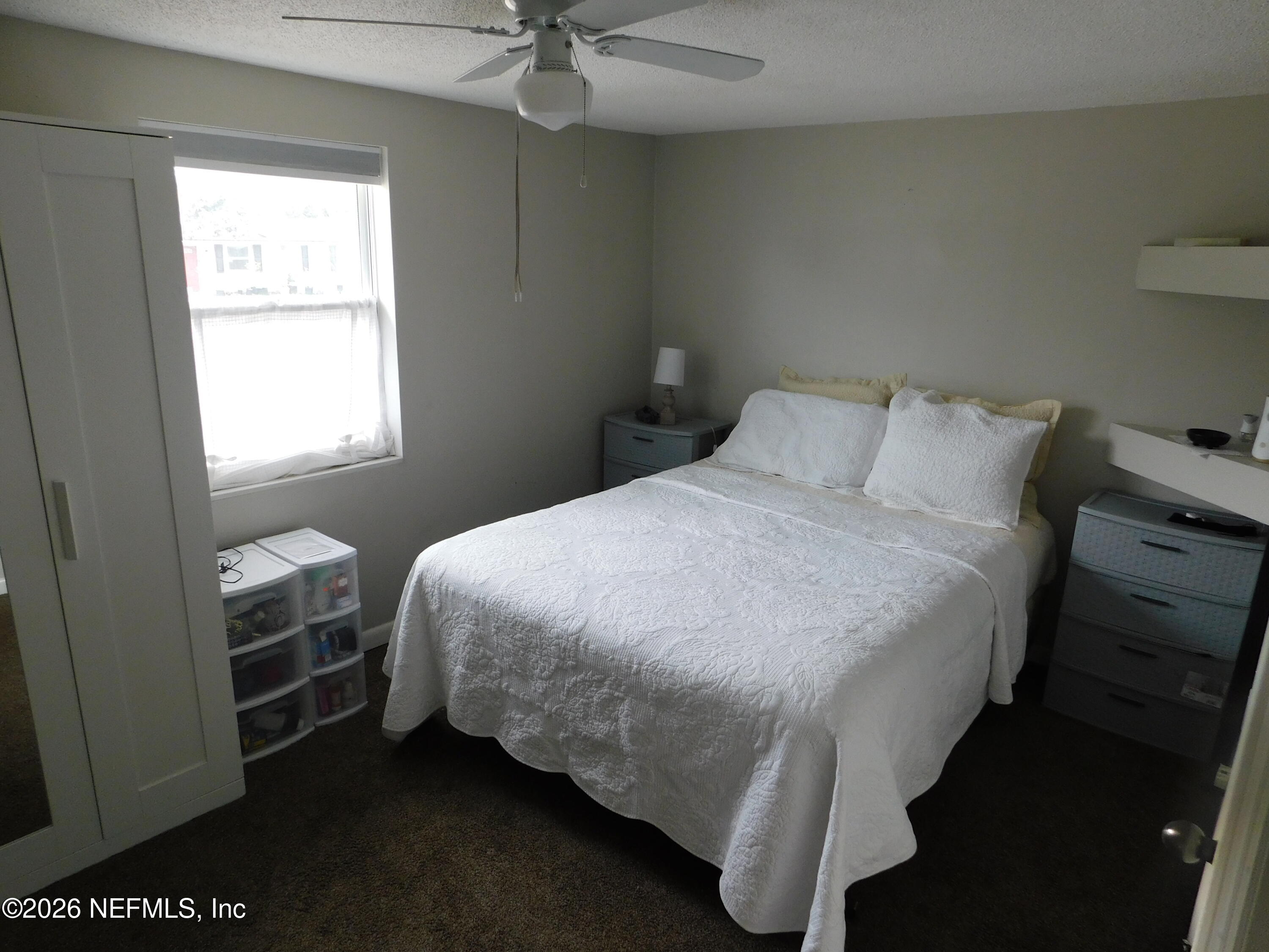 2798 Commanche Avenue Orange Park, FL 32065 - Photo 9 of 42 a bedroom with a bed and a window