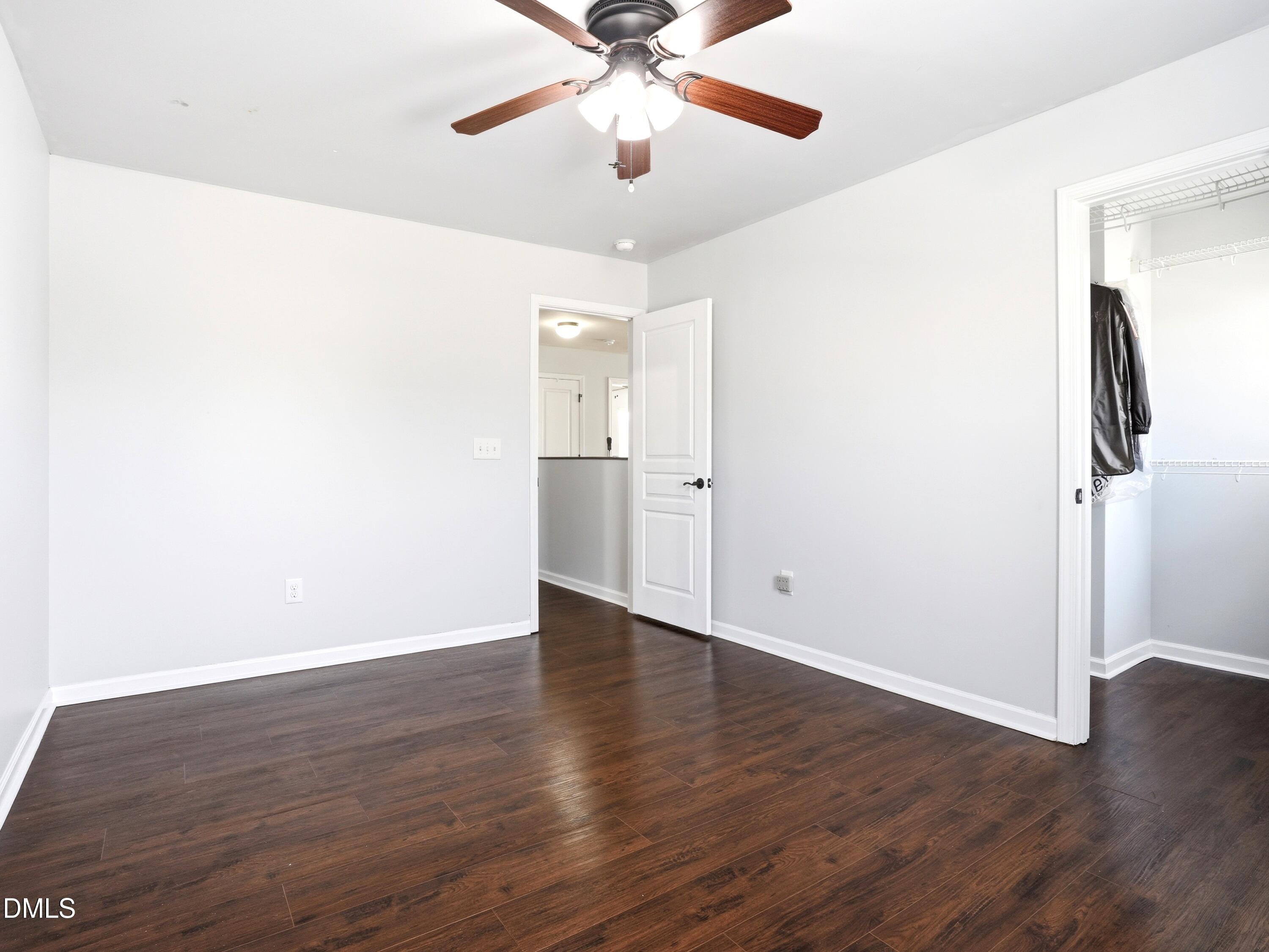 8128 Hovingham Way Raleigh, NC 27616 - Photo 25 of 40 a view of an empty room with wooden floor