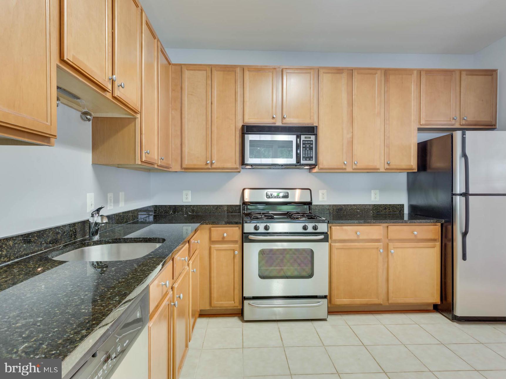 1511 North Point Drive, Unit 104 Reston, VA 20194 - Photo 12 of 28 SS Appliances, 42'Cabinets