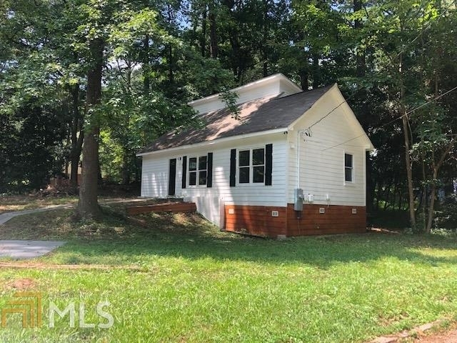 2505 Stone Road East Point, GA 30344 - Photo 1 of 1 a front view of a house with a yard