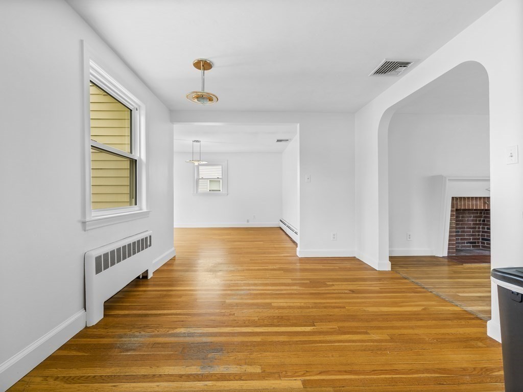 51 Albemarle Road Newton, MA 02460 - Photo 12 of 31 a view of an empty room with wooden floor and a window