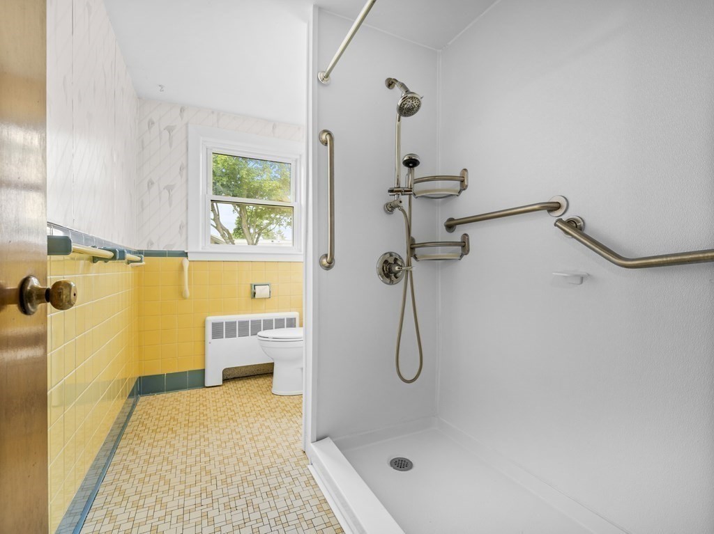 51 Albemarle Road Newton, MA 02460 - Photo 15 of 31 a bathroom with a bath tub with a shower