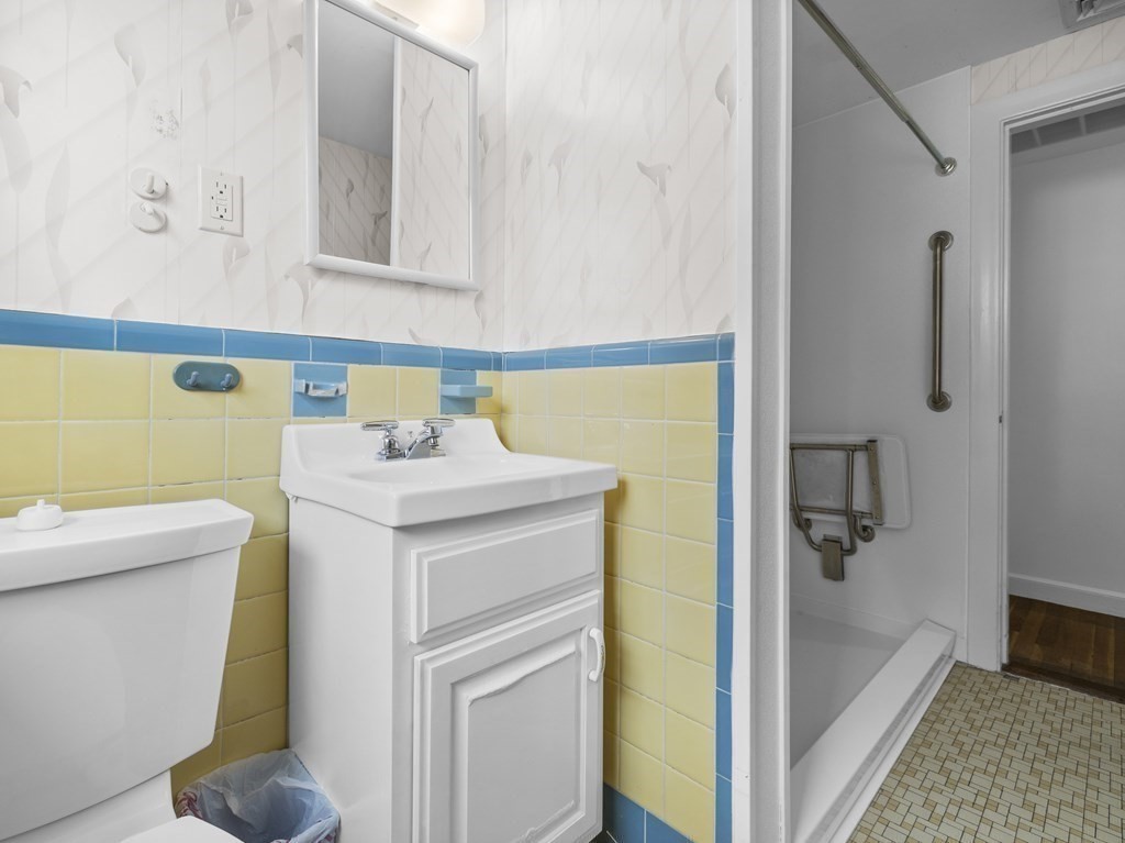 51 Albemarle Road Newton, MA 02460 - Photo 16 of 31 a bathroom with a sink a toilet and shower