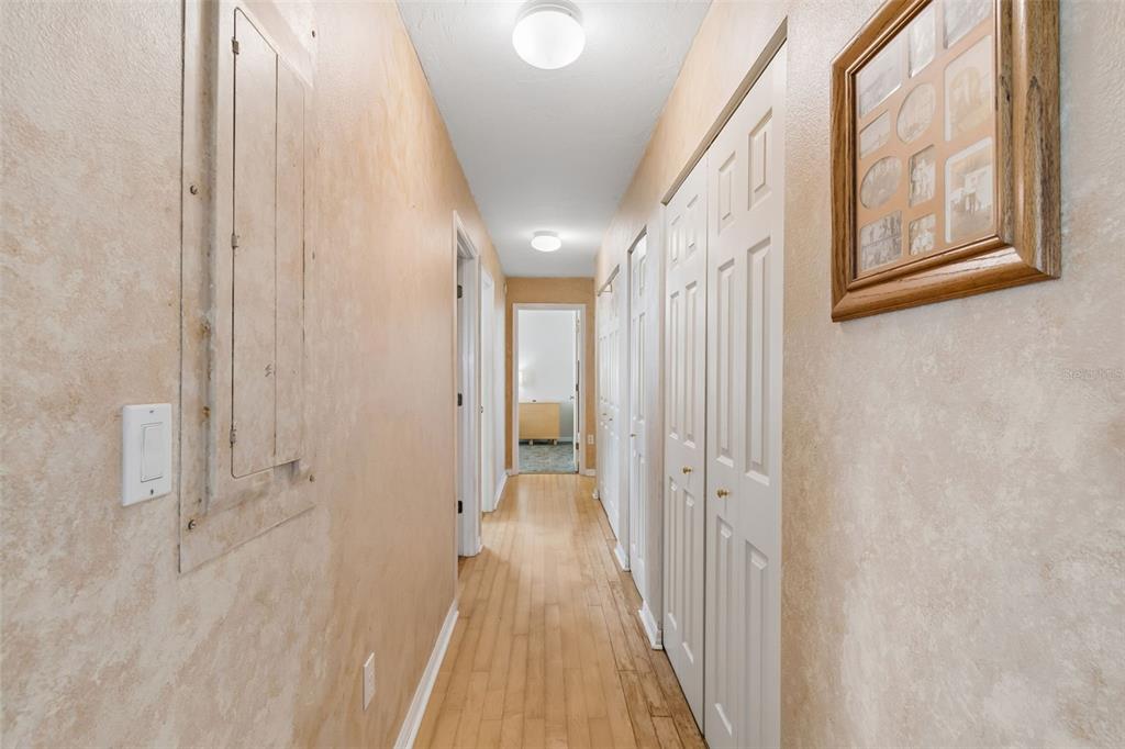 119 Burns Road Terra Ceia, FL 34250 - Photo 63 of 100 a view of a hallway with wooden floor and a bathroom