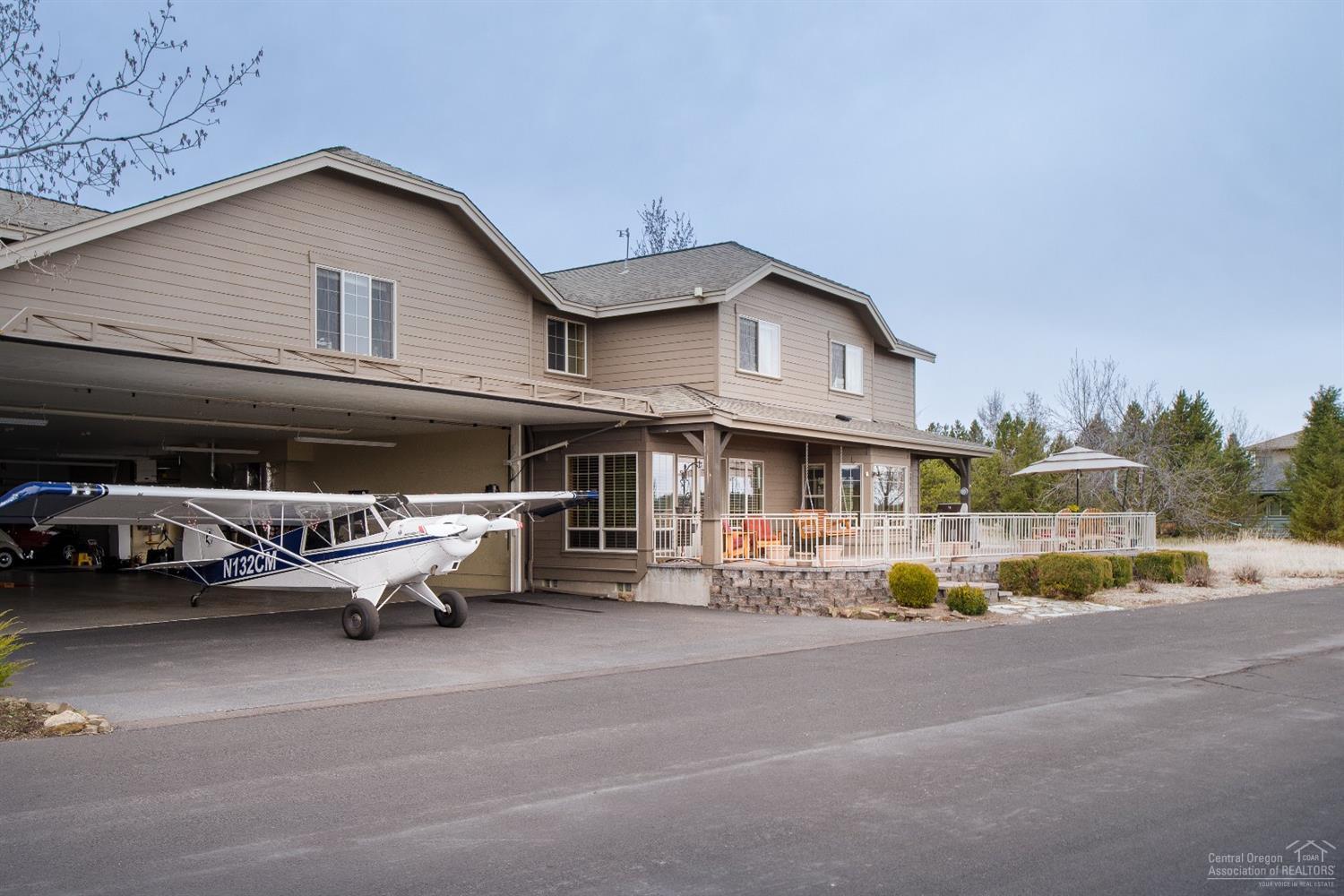 56902 River Road Sunriver, OR 97707 - Photo 2 of 24 The 38'6" wide by 11'3" high hydraulic h