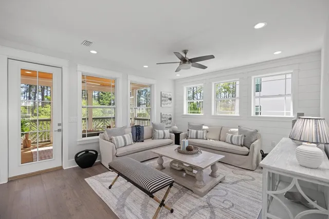 a balcony with couch and wooden floor