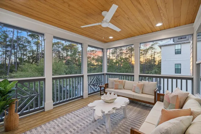a view of a balcony with wooden floor