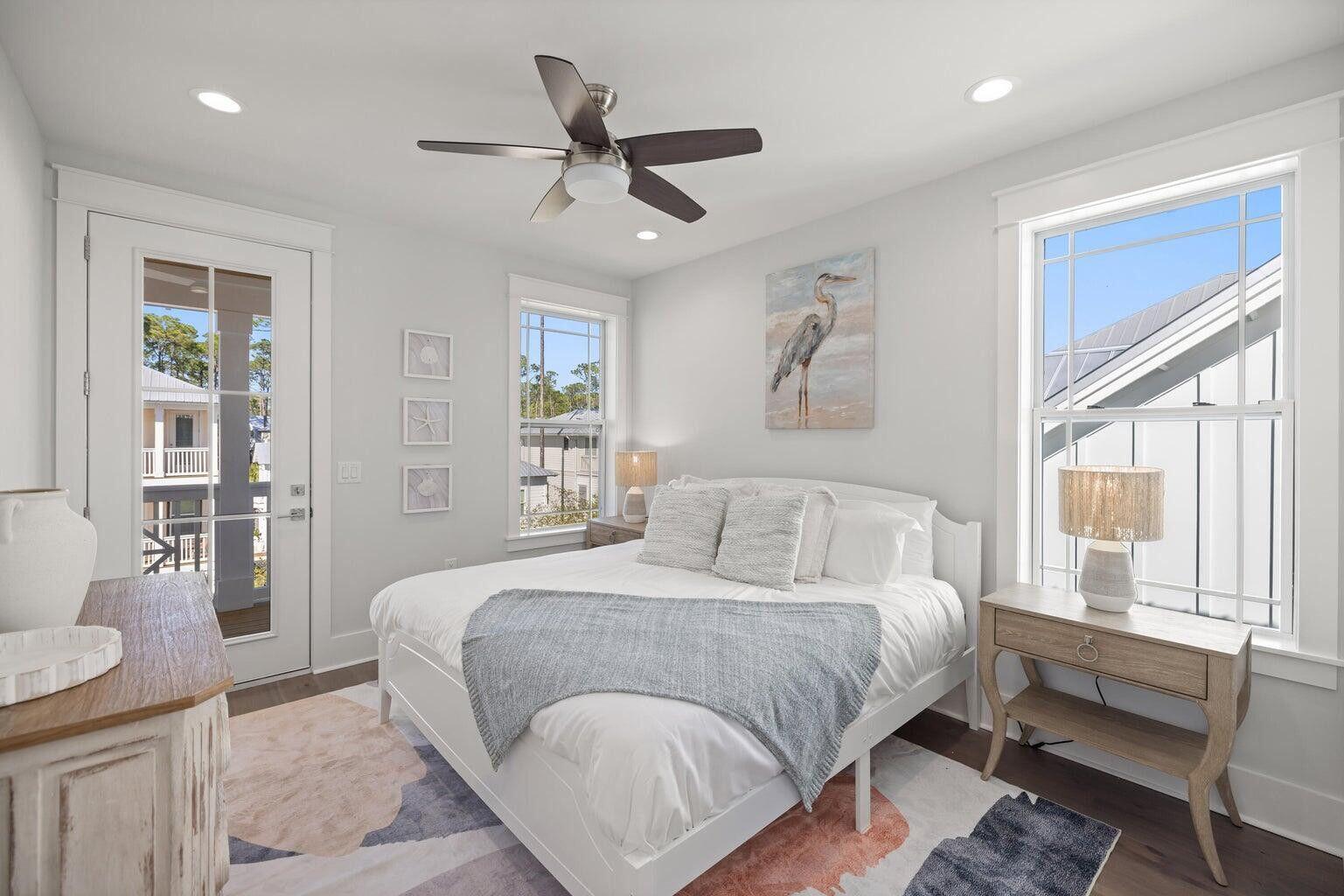 171 Redbud Ln Inlet Beach Inlet Beach, FL 32461 - Photo 21 of 38 a bedroom with a large bed and a couch