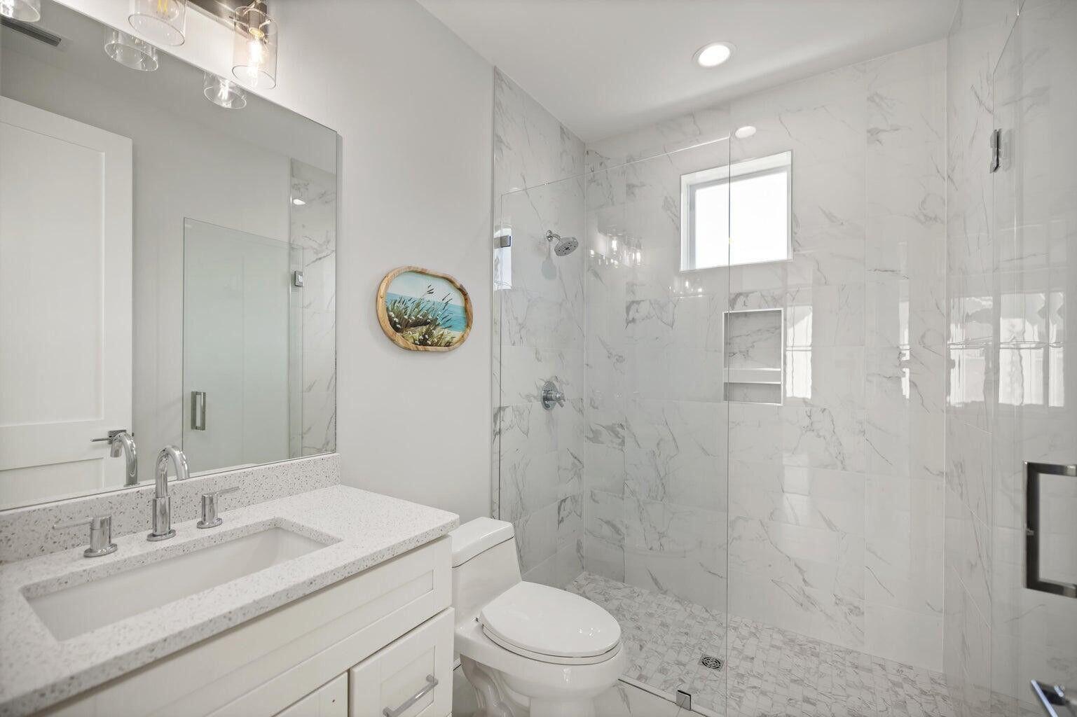 171 Redbud Ln Inlet Beach Inlet Beach, FL 32461 - Photo 25 of 38 a bathroom with a sink a toilet and shower