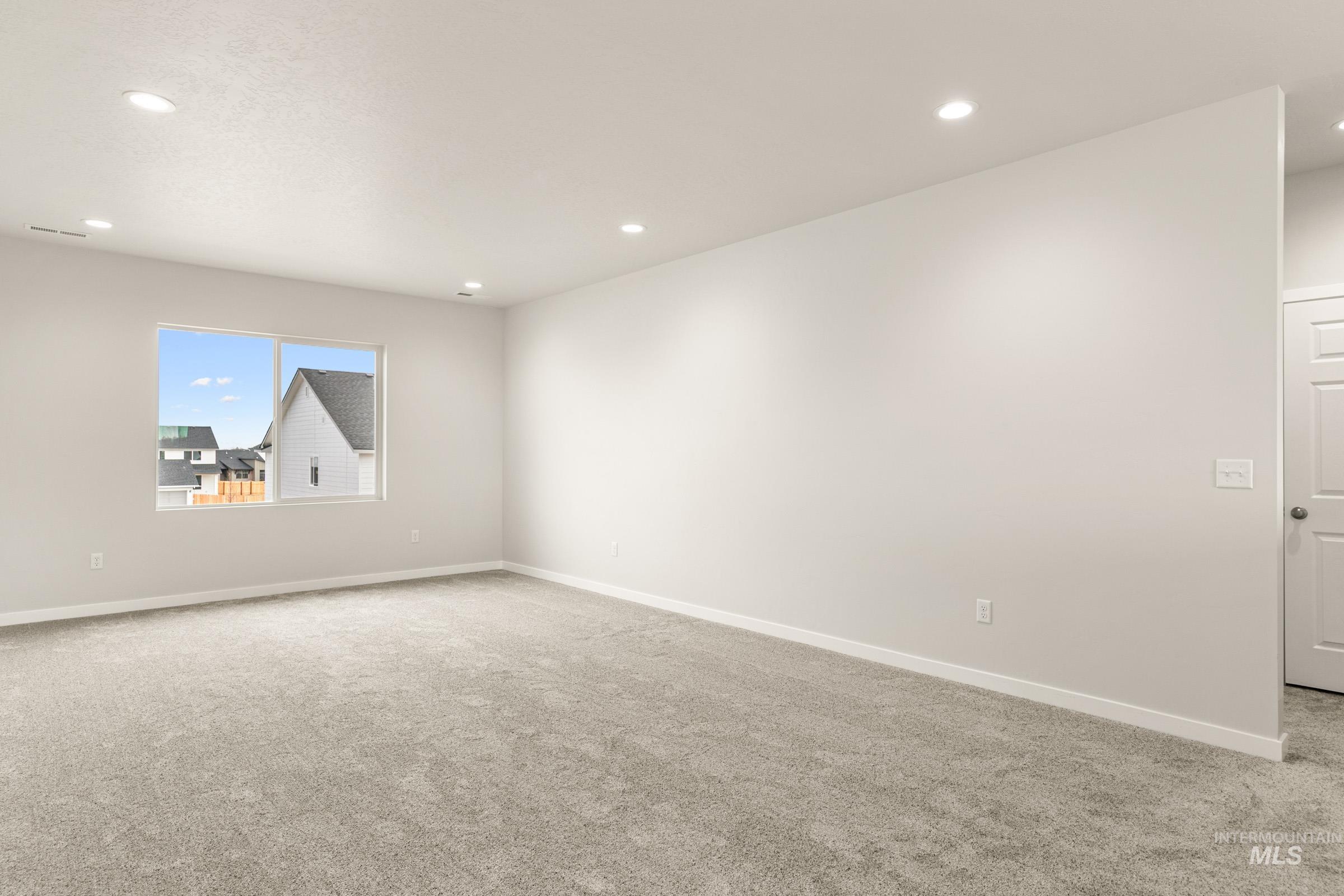 13688 Redway Court Caldwell, ID 83607 - Photo 17 of 26 Empty room featuring carpet and recessed lighting