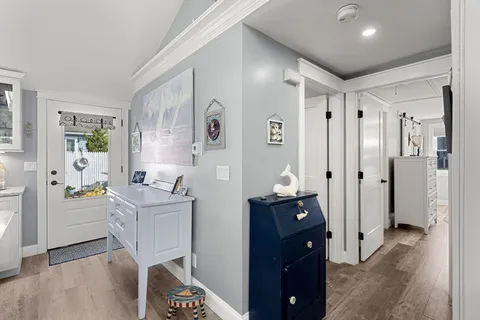 a spacious bathroom with a bathtub sink and mirror