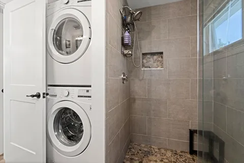 a bathroom with a sink a toilet and a shower