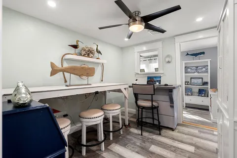 a dining room with furniture and window