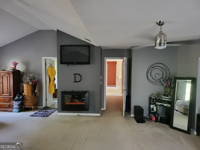 a bedroom with furniture and a chandelier