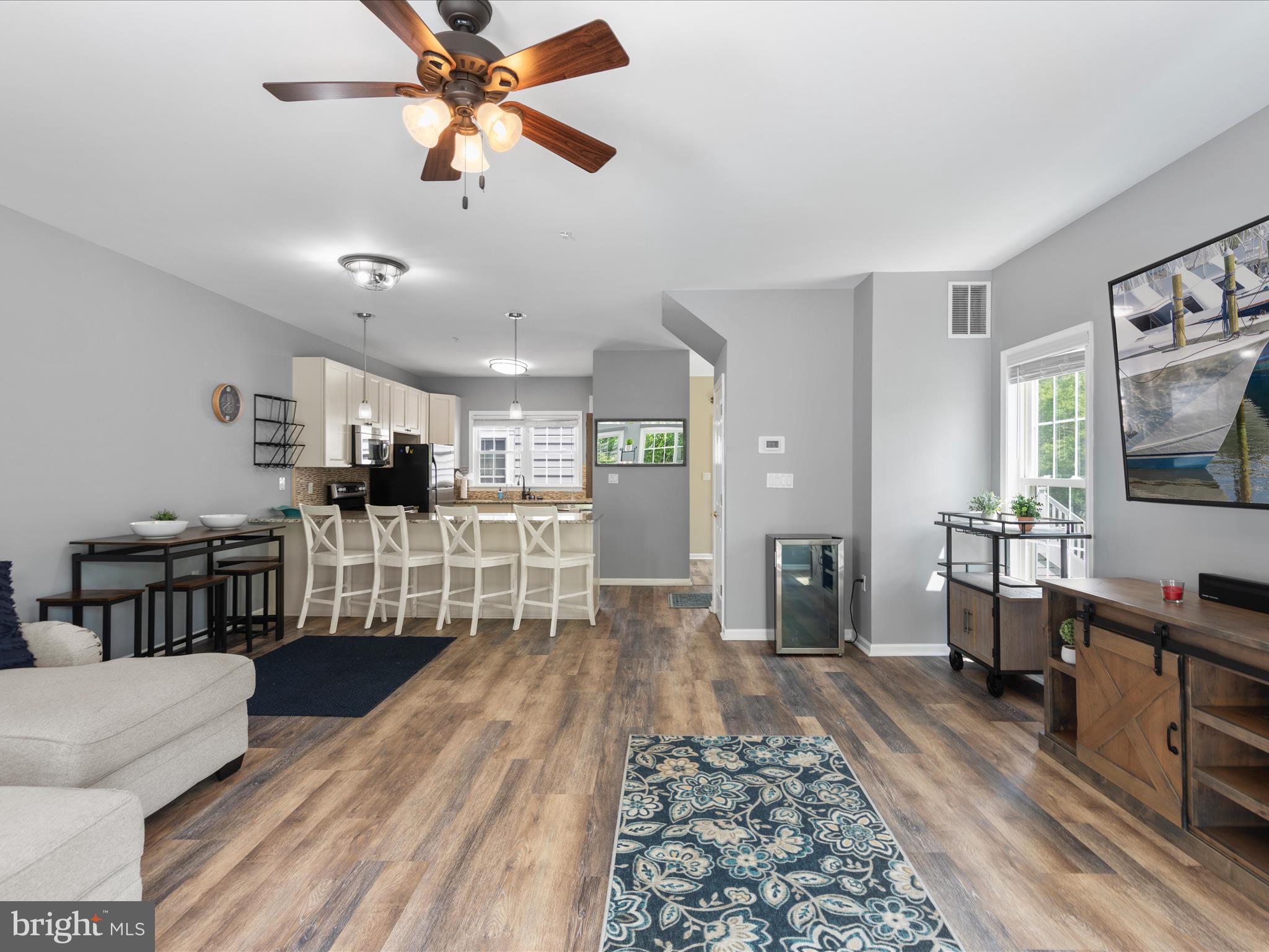 9739 Golf Course Road, Unit D102 Ocean City, MD 21842 - Photo 19 of 42 a living room with furniture and a flat screen tv