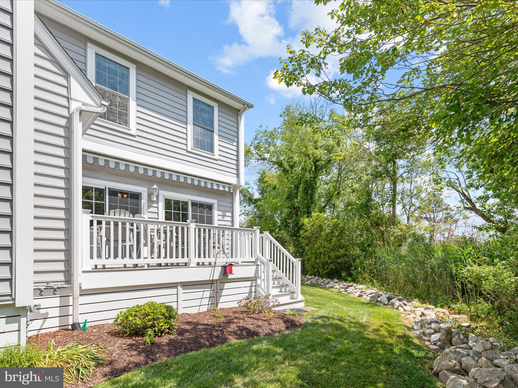 9739 Golf Course Road, Unit D102 Ocean City, MD 21842 - Photo 40 of 42 a front view of a house with a yard