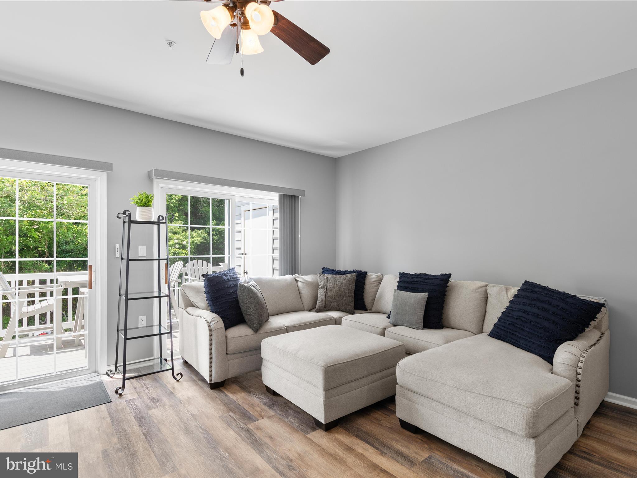 9739 Golf Course Road, Unit D102 Ocean City, MD 21842 - Photo 8 of 42 a living room with furniture and a large window