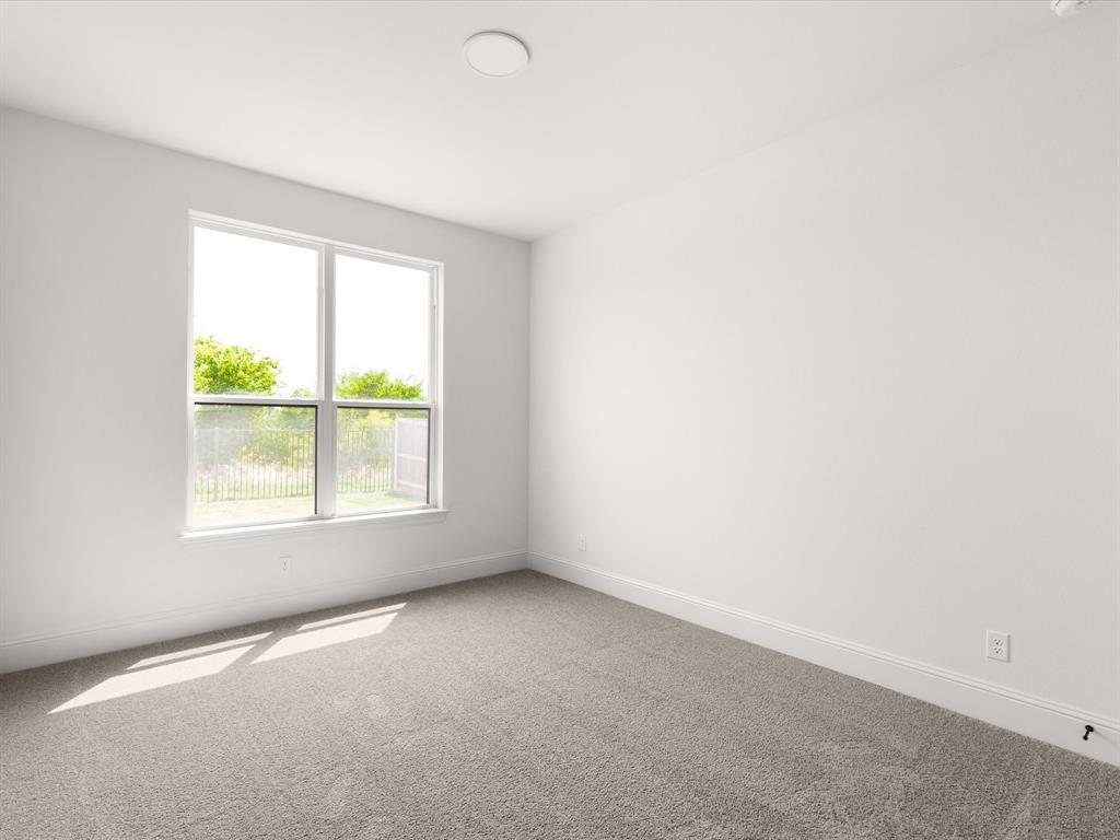 7104 Prairie Ridge Road Argyle, TX 76226 - Photo 20 of 39 Carpeted spare room with baseboards