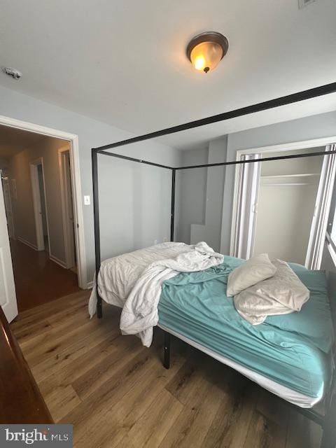 2546 North 7th Street, Unit 2 Philadelphia, PA 19133 - Photo 10 of 11 a bedroom with a bed and a mirror on the dresser