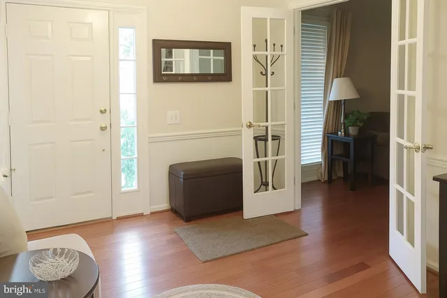 a view of a livingroom with furniture and wooden floor