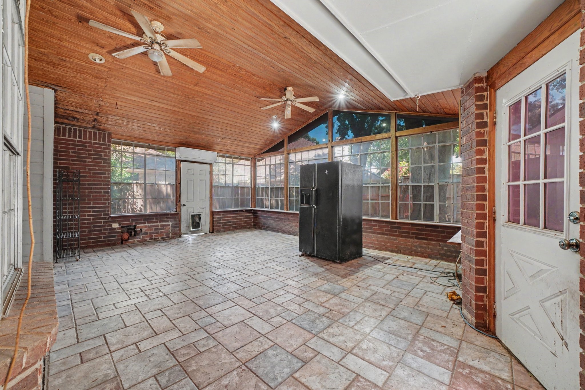7918 Duncansby Vale Road Houston, TX 77095 - Photo 28 of 39 Step into a covered sunroom addition with detailed vaulted ceiling, patterned tile flooring and views of the backyard!