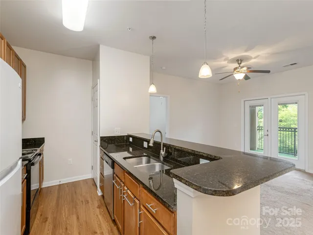 a kitchen with a sink and a refrigerator