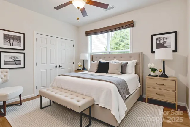 a bedroom with a bed and a couch