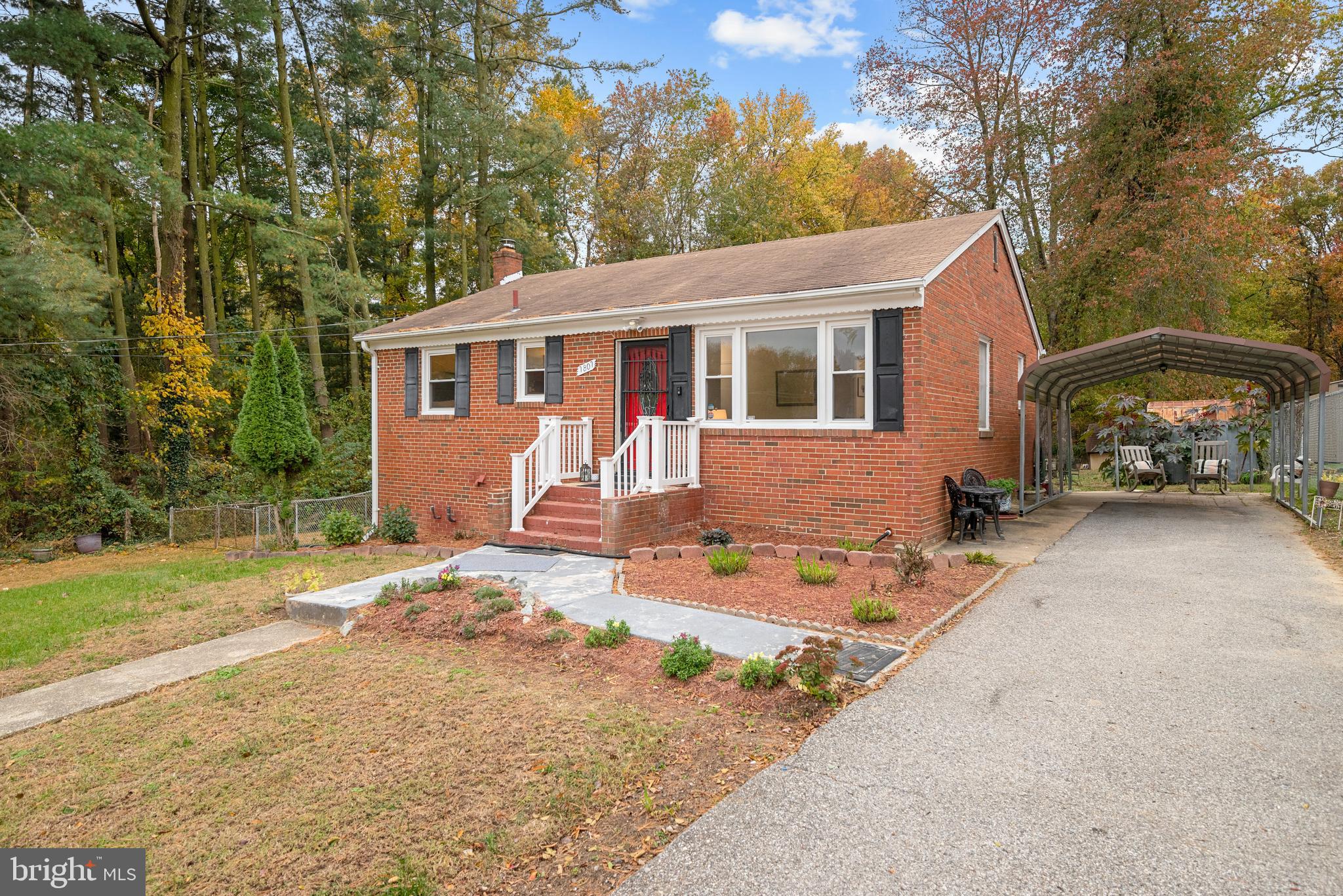 a view of a house with a yard covered in snow