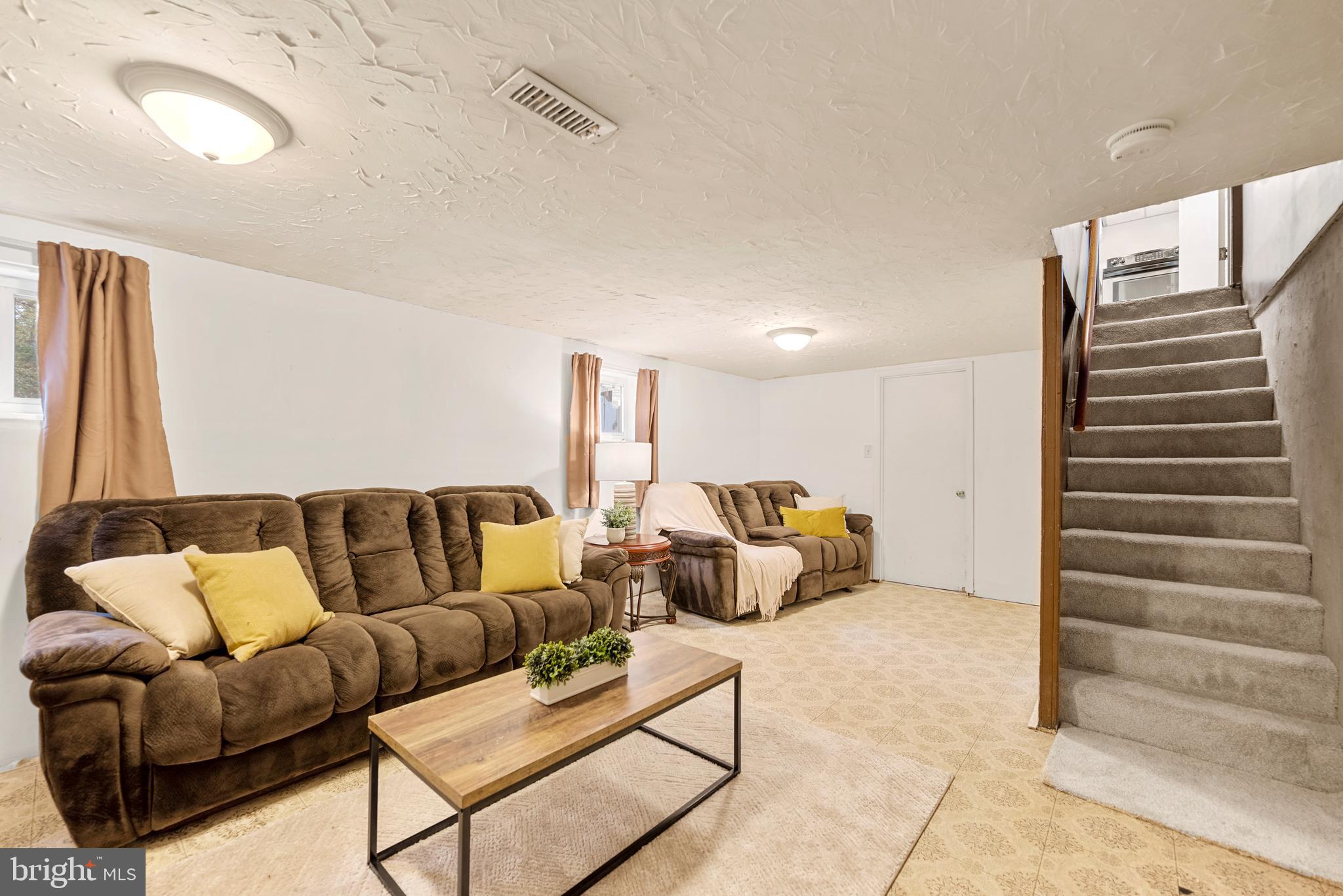 7807 Colonial Lane Clinton, MD 20735 - Photo 18 of 29 a living room with furniture and a couch