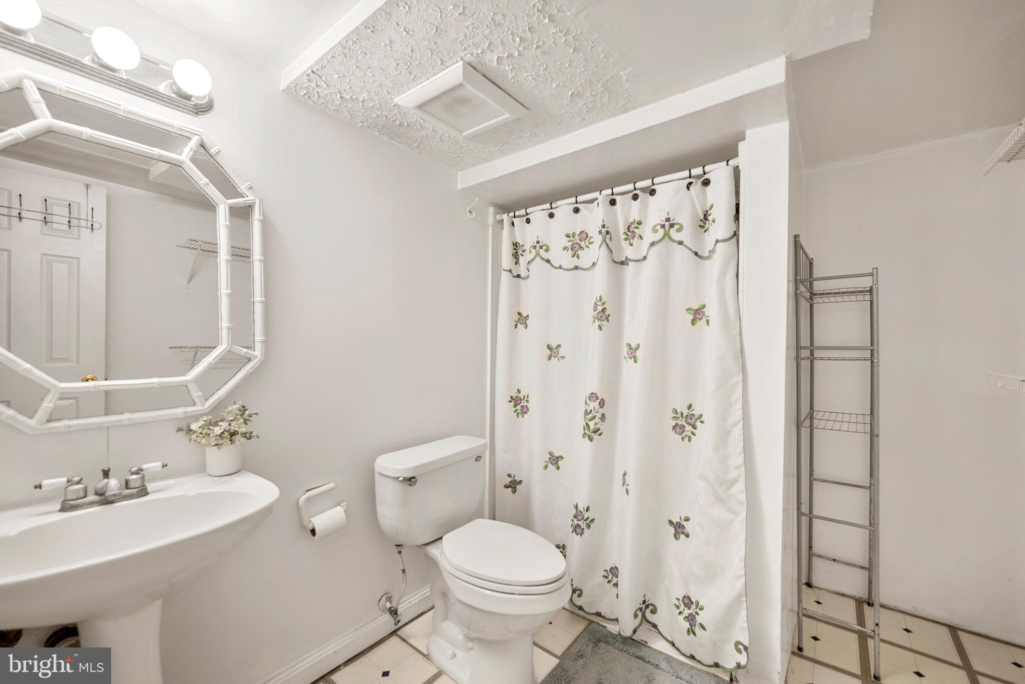 7807 Colonial Lane Clinton, MD 20735 - Photo 19 of 29 a bathroom with a sink toilet and shower