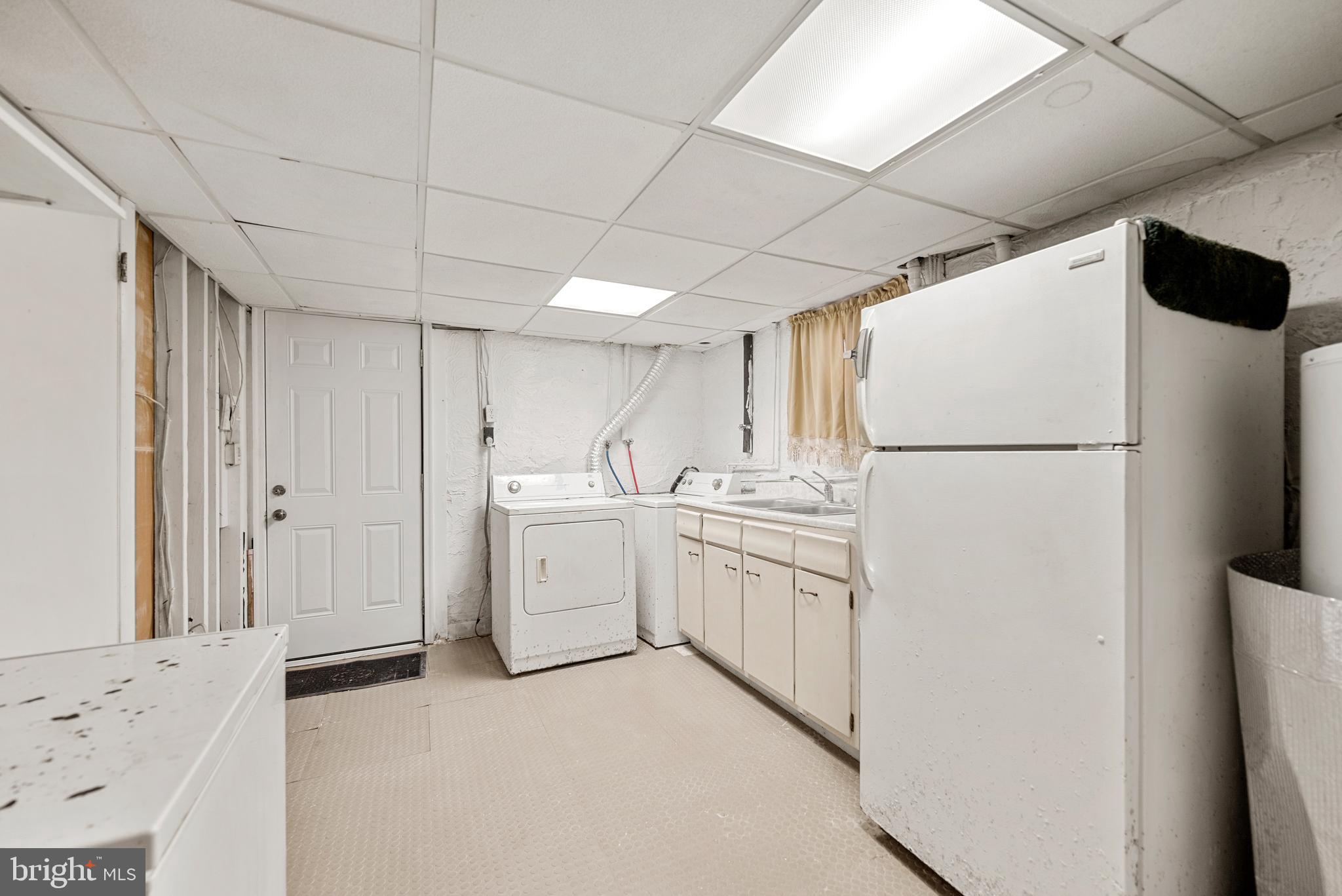 7807 Colonial Lane Clinton, MD 20735 - Photo 20 of 29 a kitchen with white cabinets and white appliances