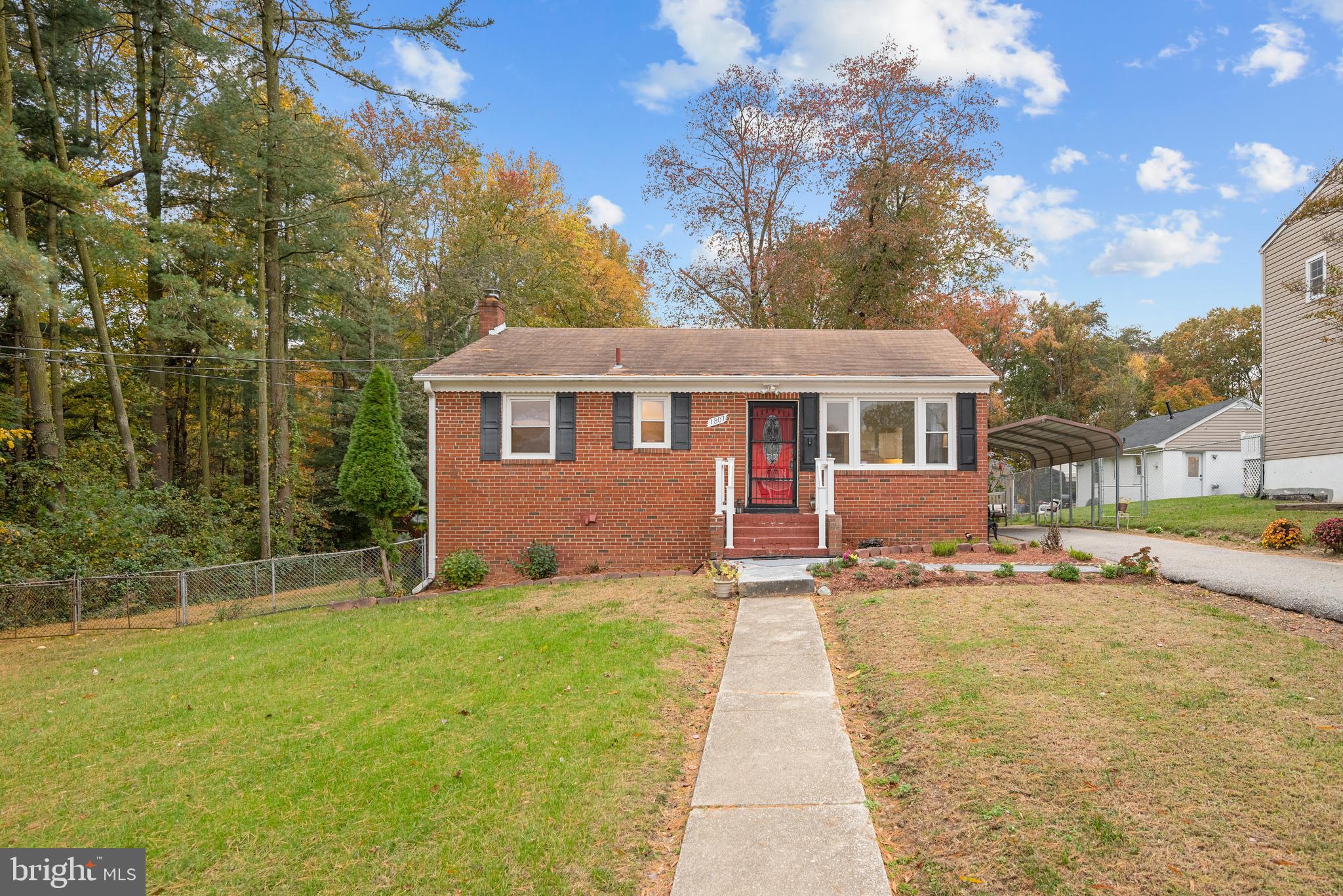 7807 Colonial Lane Clinton, MD 20735 - Photo 28 of 29 a front view of a house with a yard table and chairs