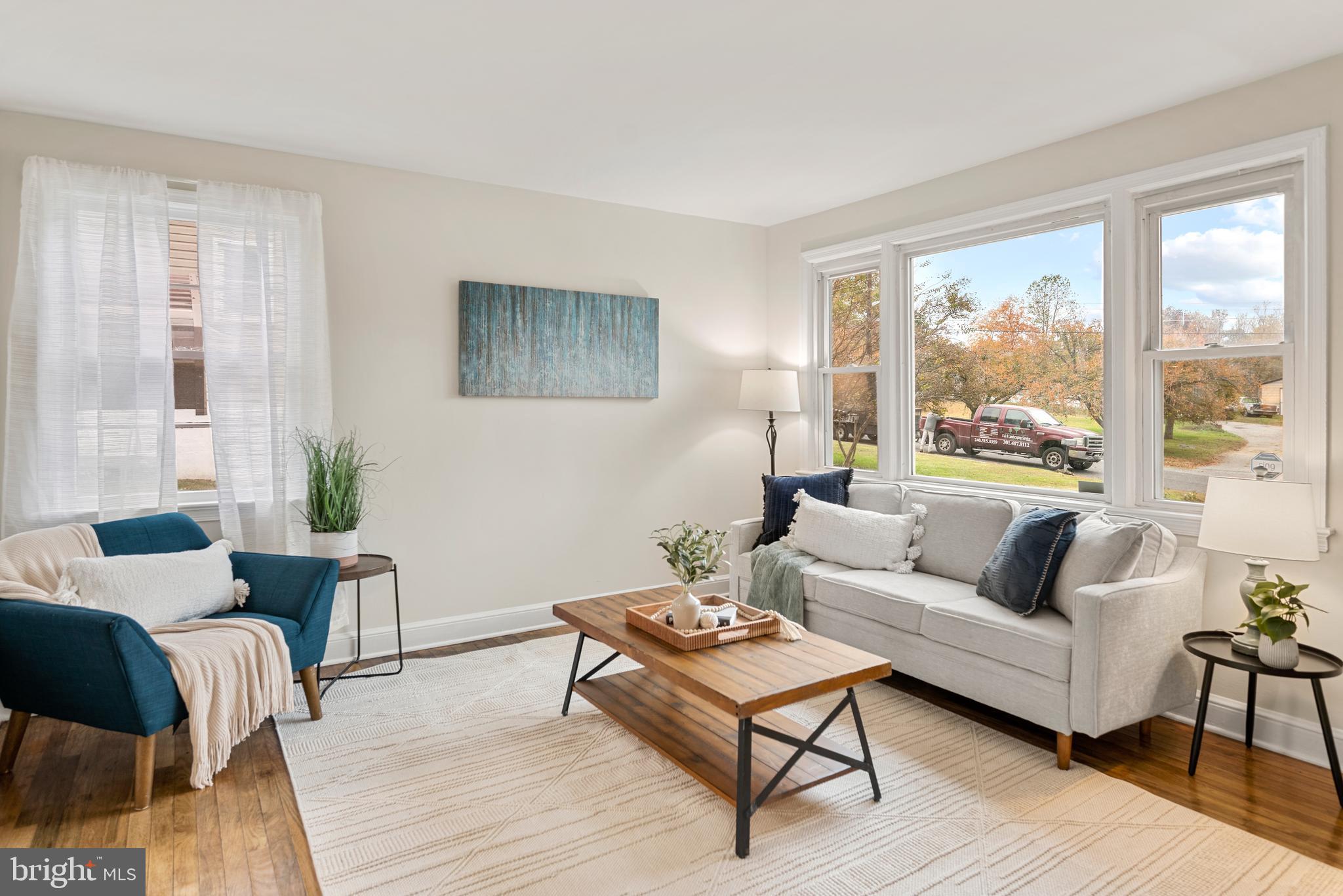 7807 Colonial Lane Clinton, MD 20735 - Photo 8 of 29 a living room with furniture and a large window