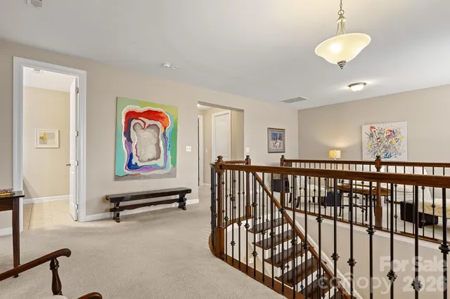 a view of a hallway with a couch and toys