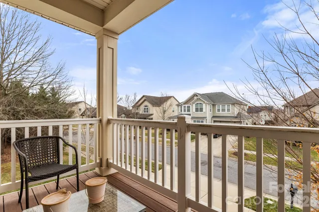 a view of a chair and table in the balcony