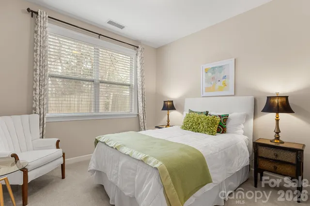 a bedroom with a bed and a couch